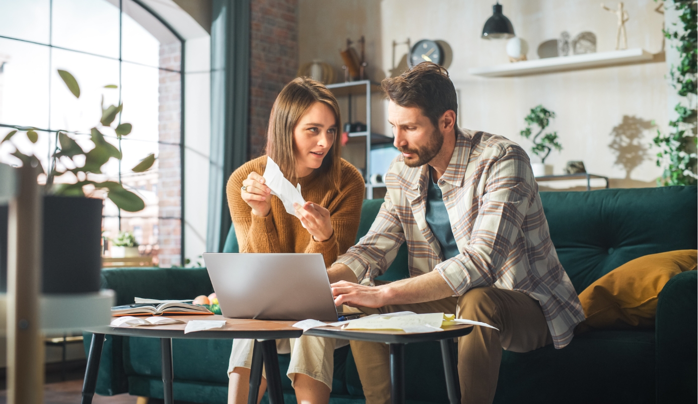 man and woman looking at computer