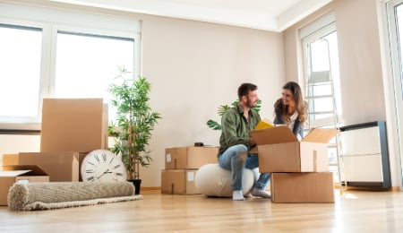 couple unpacking boxes