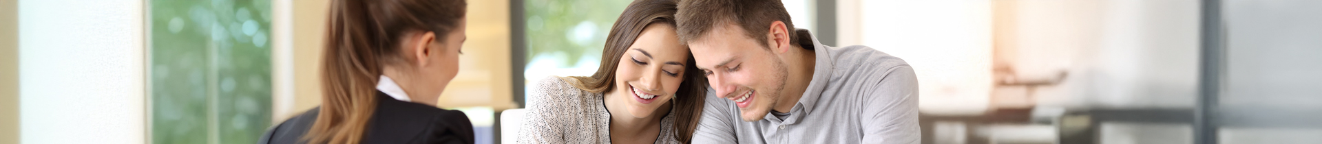 Man and Woman signing mortgage closing papers