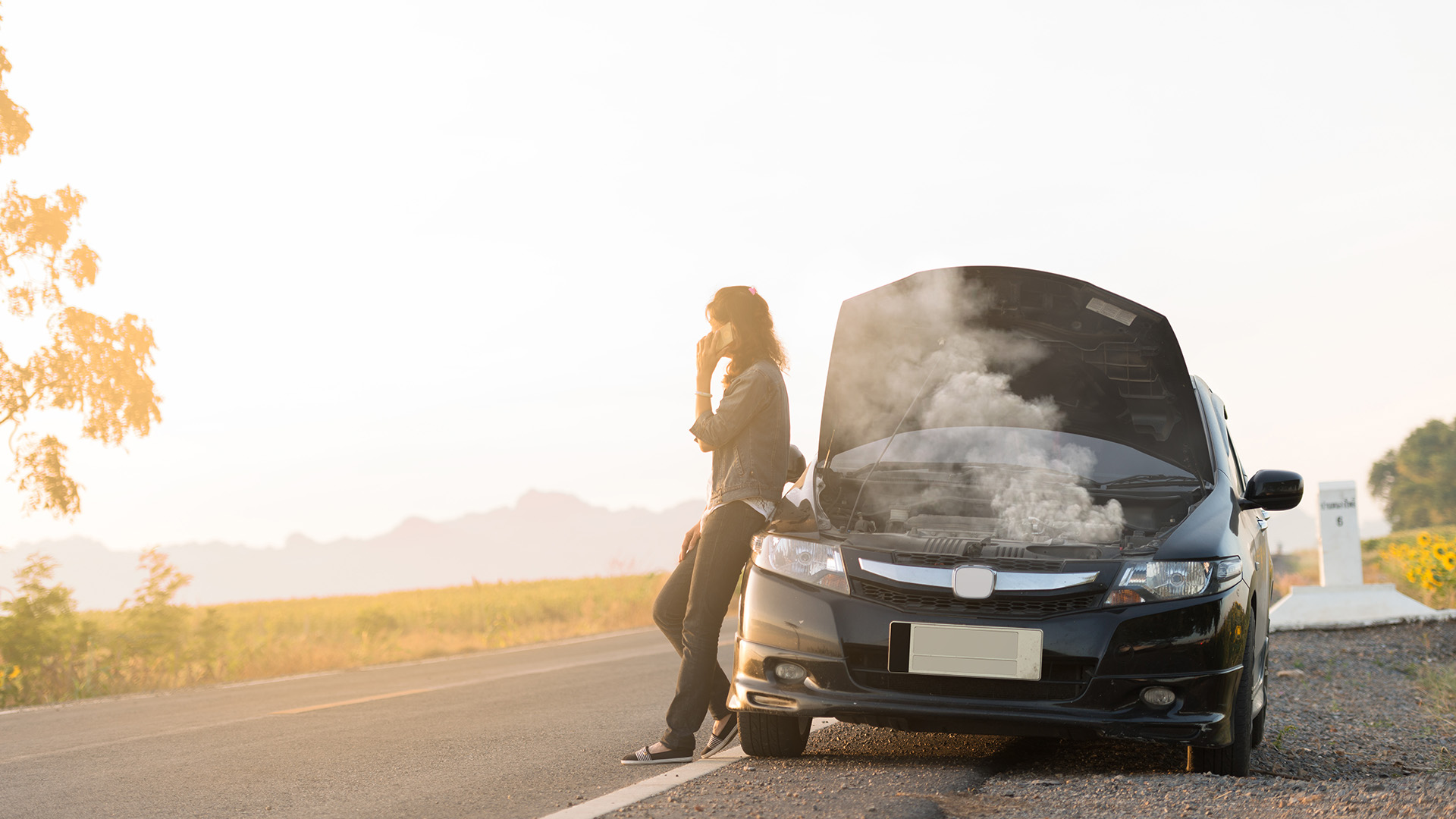 woman with broken down car