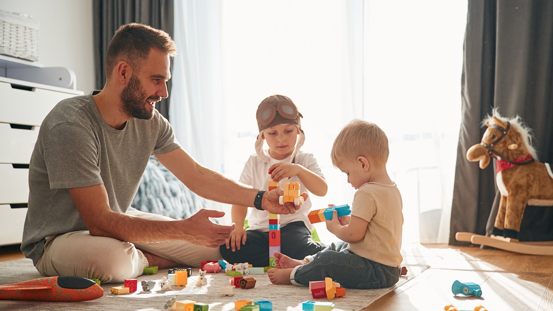 Man playing with children