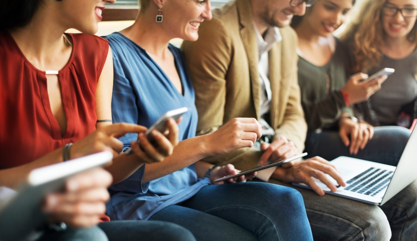 diverse people on devices