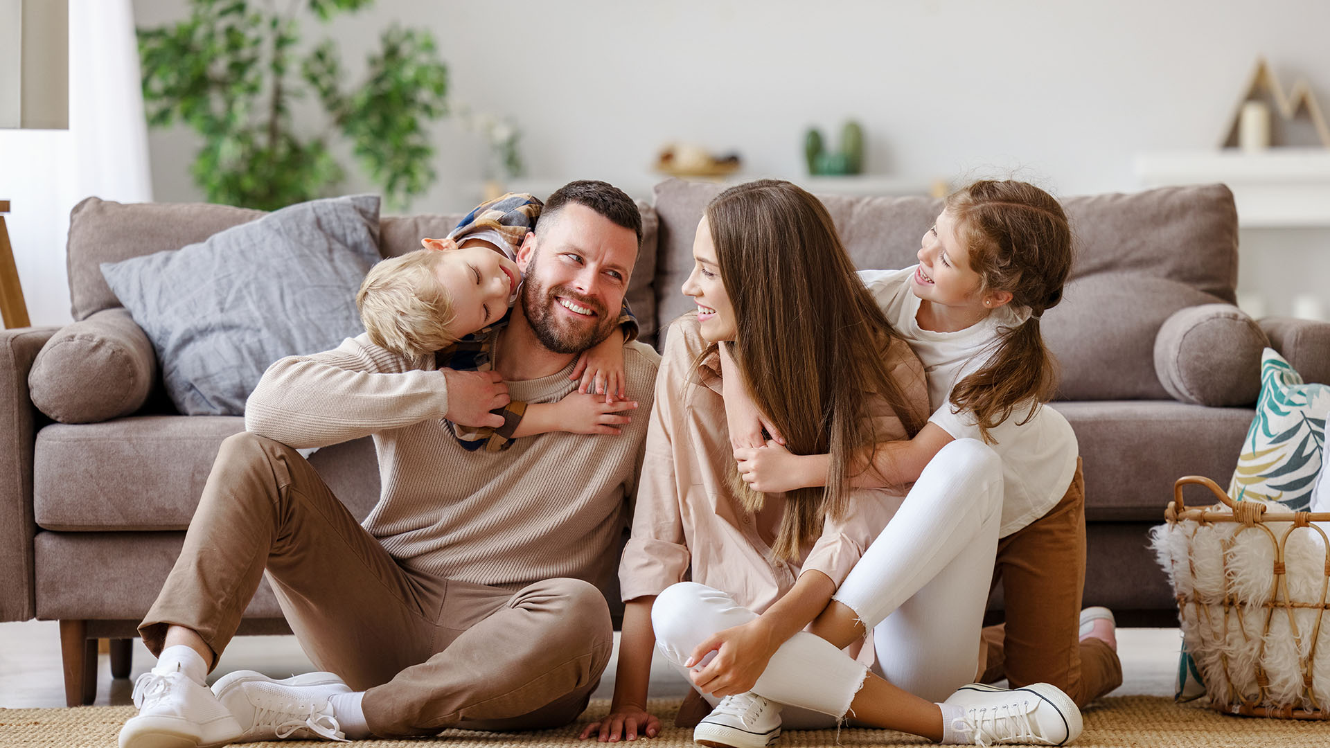 Family laughing on the sofa