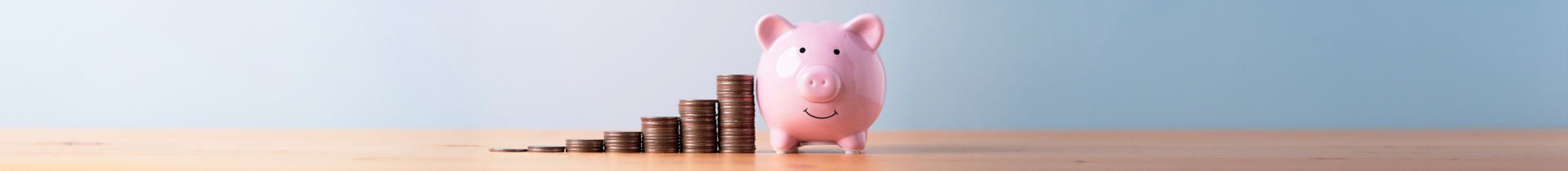 Piggy bank beside stacked coins